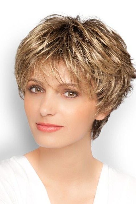 Warm brown feathered pixie, soft layers, three-quarter view for women over 60