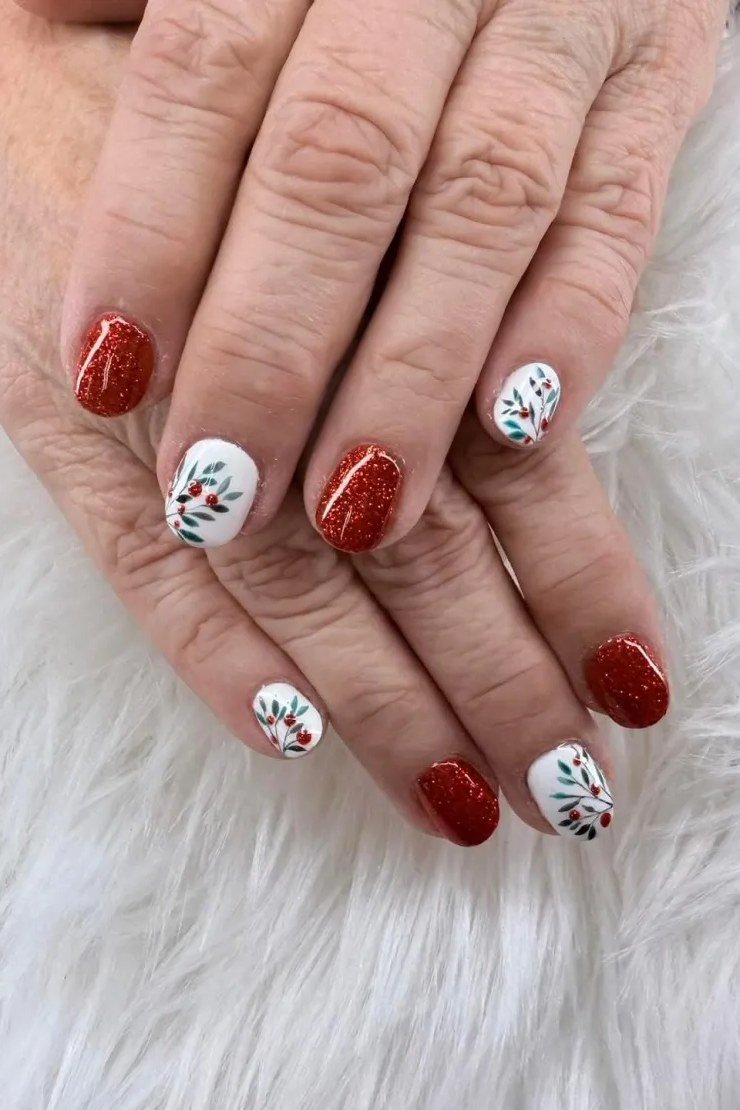 Short red with silver snowflake accents, mature hands - Christmas nail design for older women