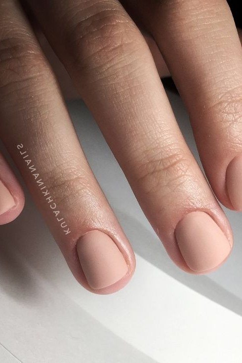 Matte nude nails on white background