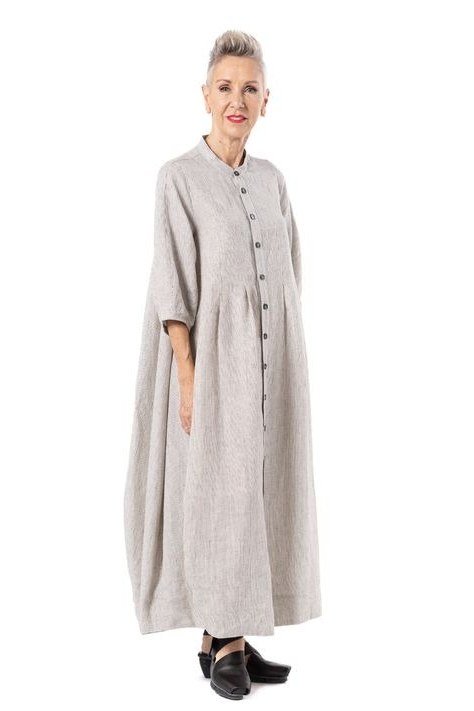 Grey button-front shirt maxi dress, older grey-haired woman, bright interior
