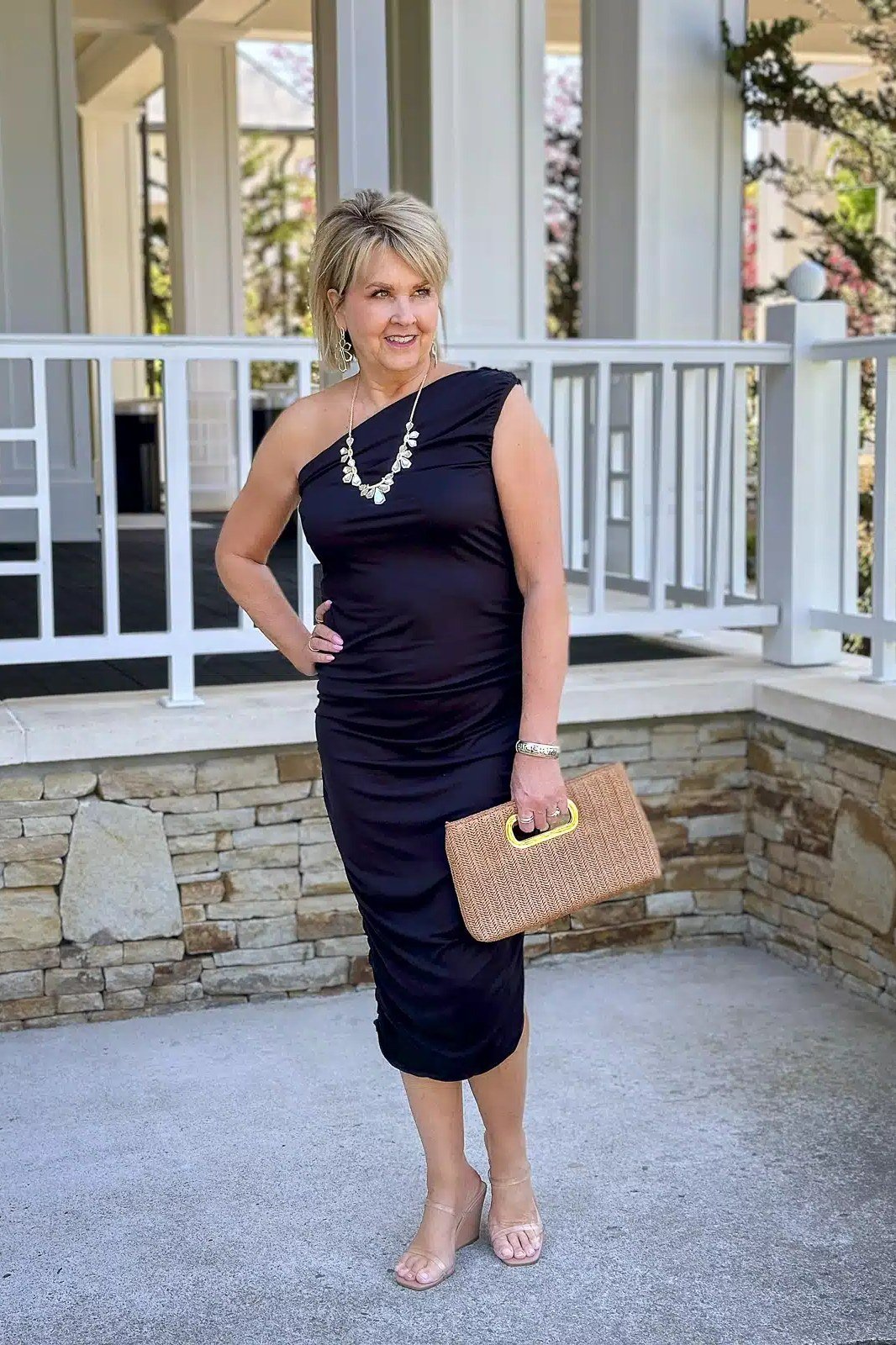 Black ruched sleeveless midi dress with pearls for women over 50
