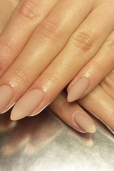 Warm nude almond nails with two hands