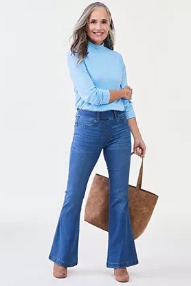 Easy casual outfit idea for women over 50: light blue turtleneck and flared jeans, older woman everyday style