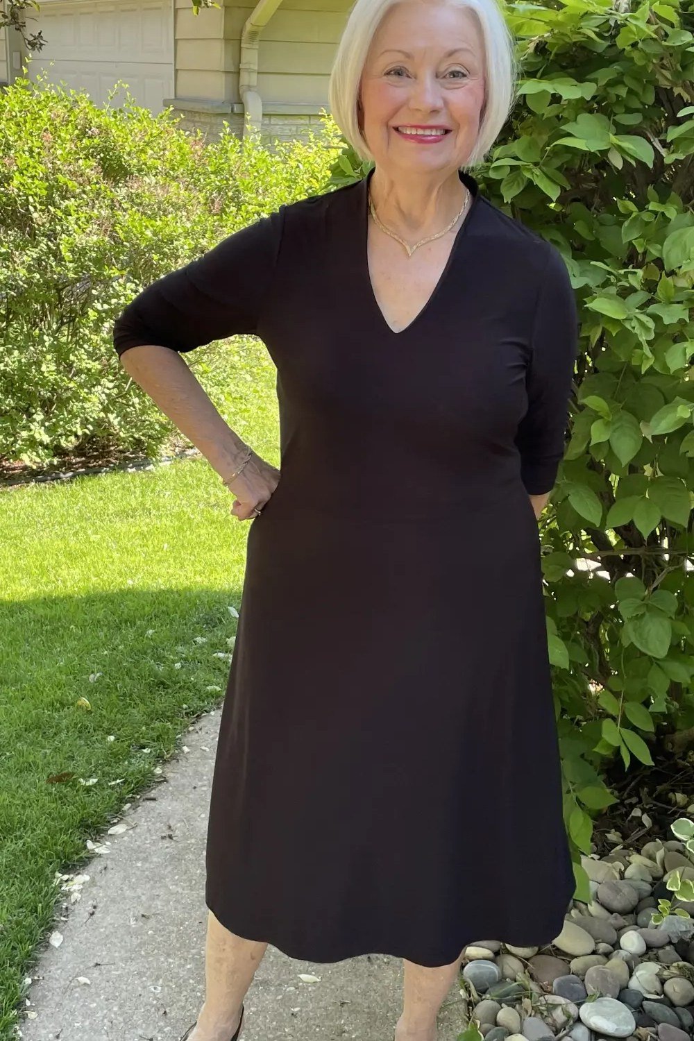 Black V-neck midi dress for women over 50