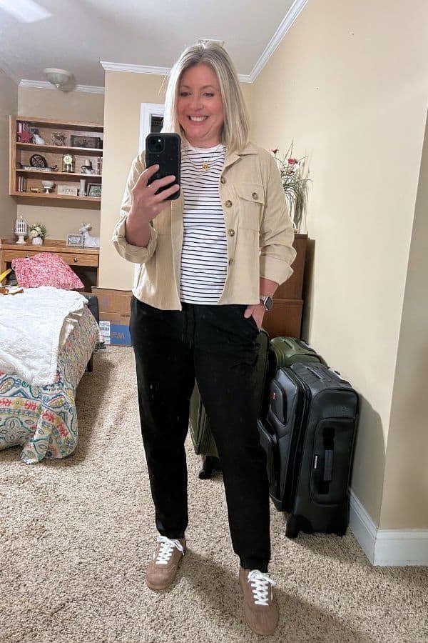 Camel Coat with a Patterned Blouse and Jeans on a woman over 50, fall outfit idea