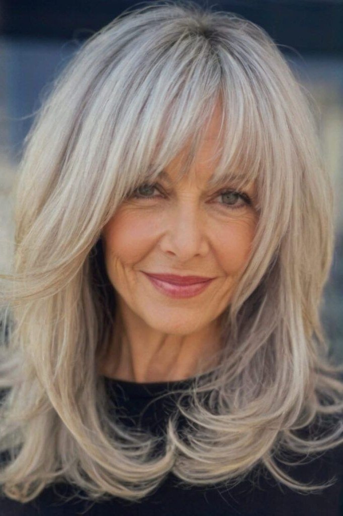 silver-white long layered medium with curtain bangs for women over 60