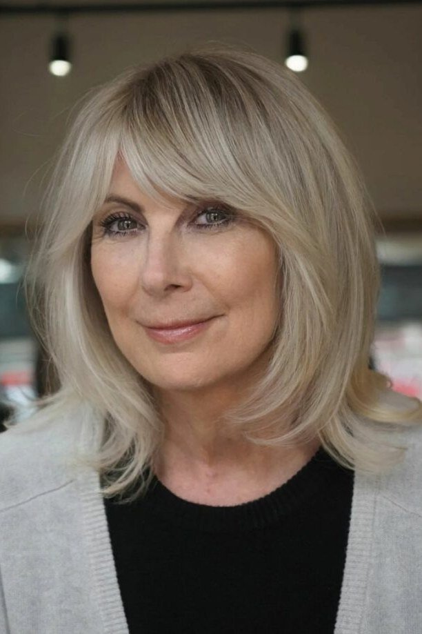 blonde layered lob with side bangs for women over 60