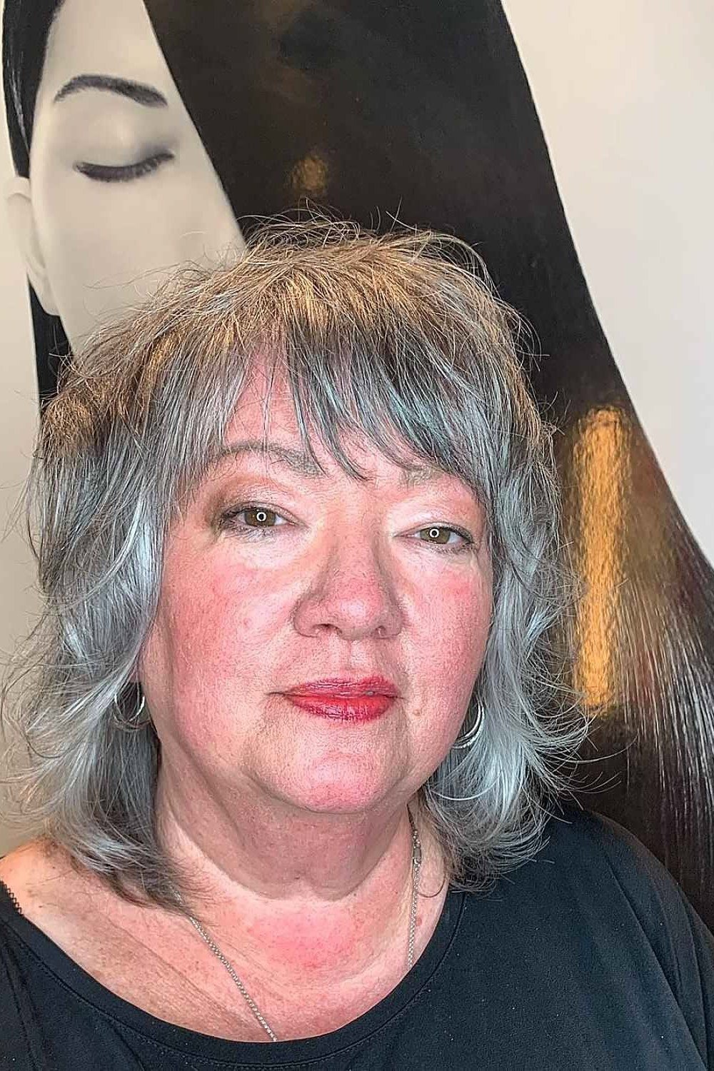 gray layered bob with bangs for women over 60