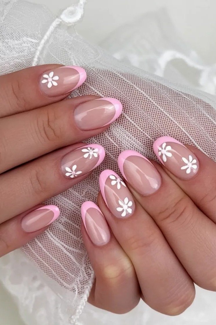 Pink french nails with daisy nail art