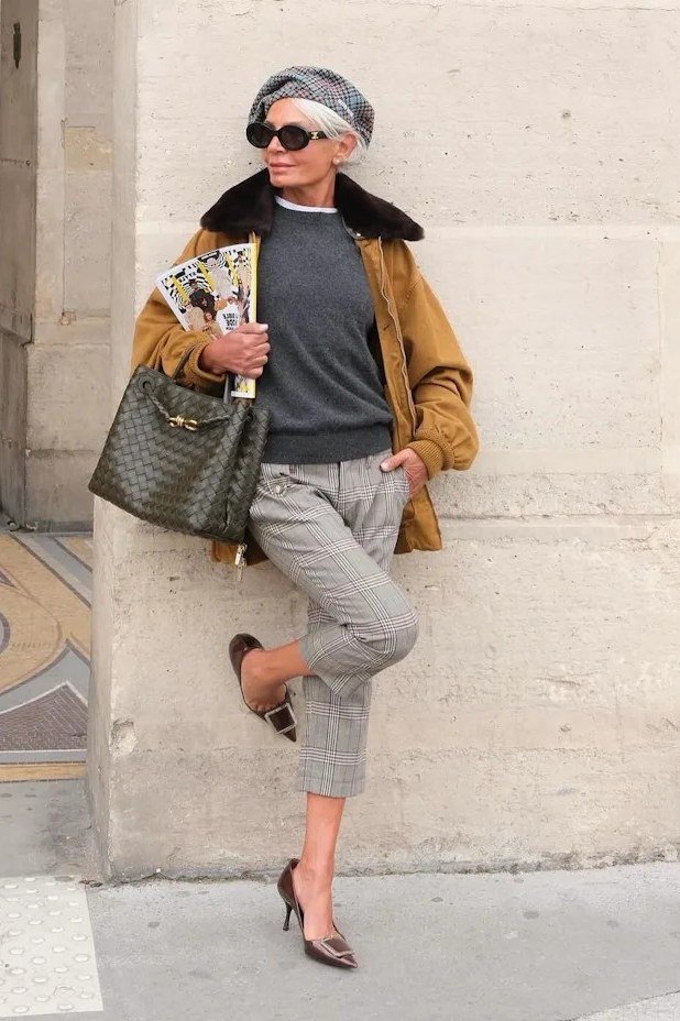 Fall city outfit for women over 50: mustard jacket gray top gray plaid trousers beret