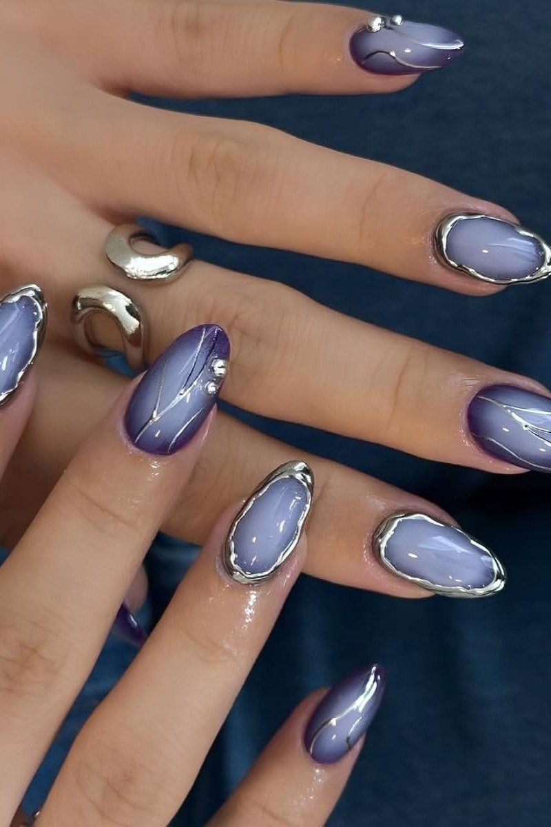 Lavender Cat Eye with Chrome Outline - Soft lavender cat eye shimmer with silver chrome outline accents covers these medium length almond nails.