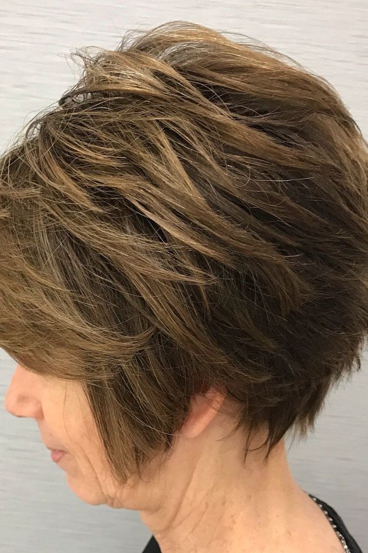 Highlighted Brown Wedge Showing Stacked Layers on a woman over 50 - flattering wedge haircut idea