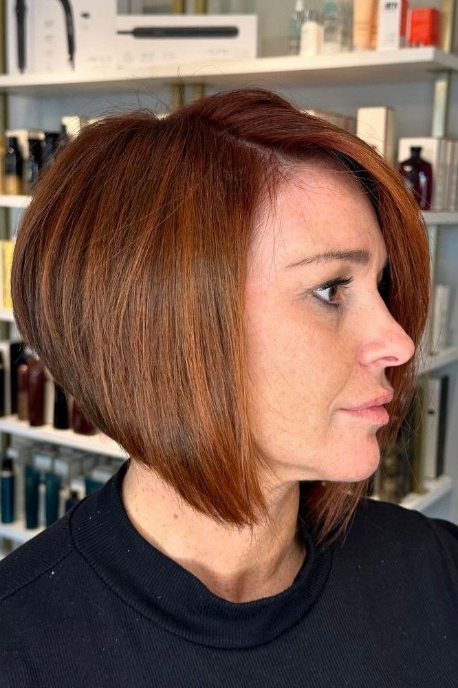 Copper Wedge Bob In Salon on a woman over 50 - flattering wedge haircut idea