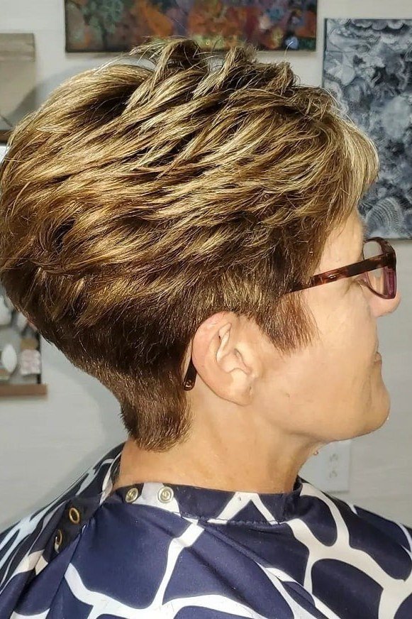 Highlighted Wedge With Glasses on a woman over 50 - flattering wedge haircut idea