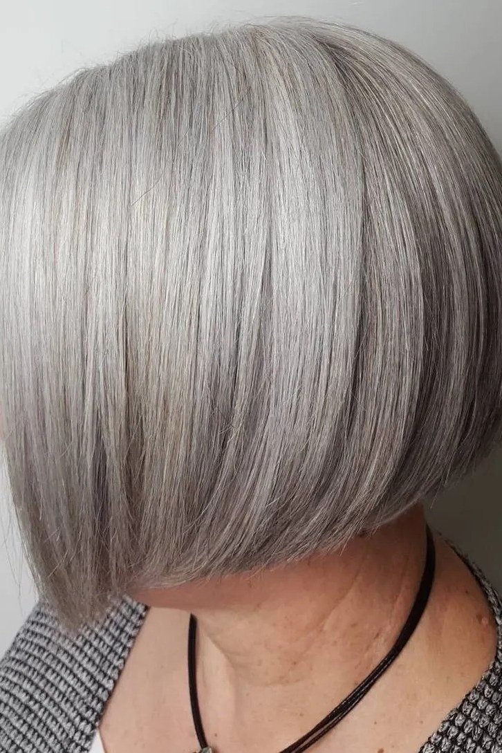 Silver angled asymmetric bob with longer front and stacked rounded back
