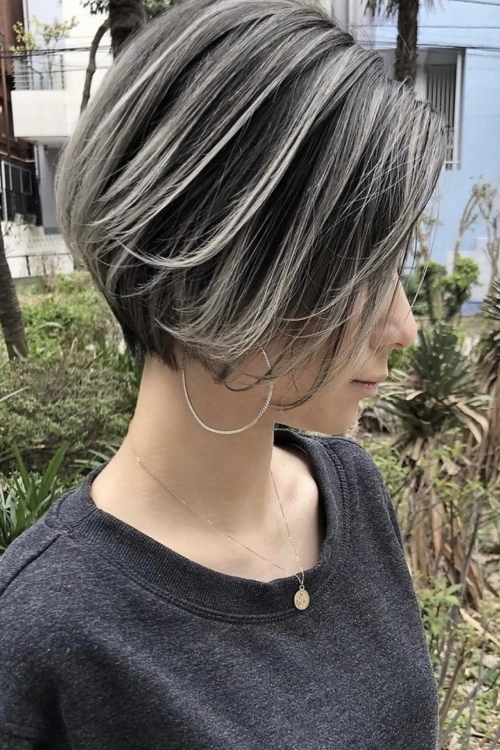 Gray layered asymmetric bob with texture, one side longer