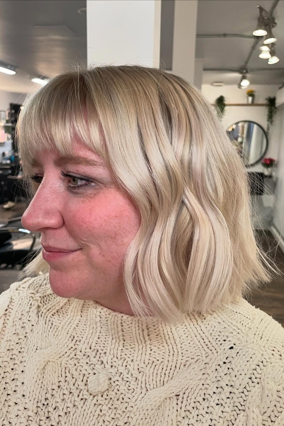 Platinum Blonde Wavy Lob with Side-Swept Bangs for Women Over 40