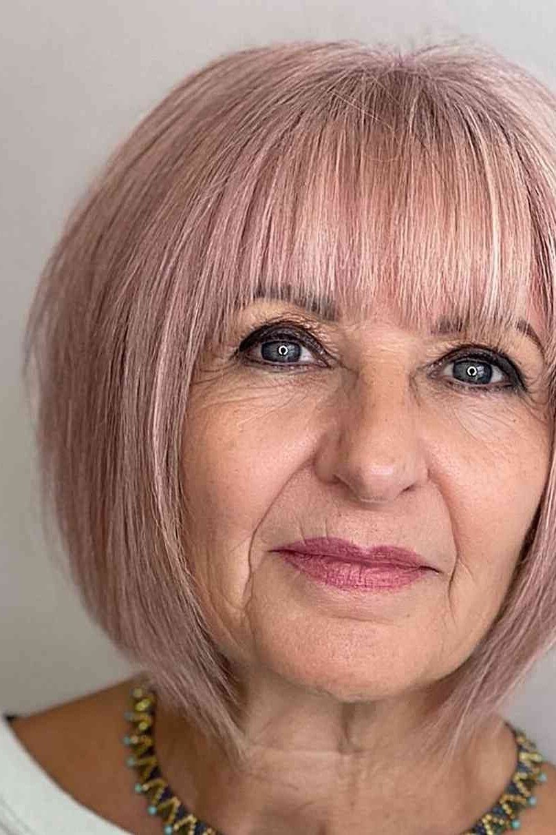 Pastel Pink Bob with Full Bangs for Women Over 40