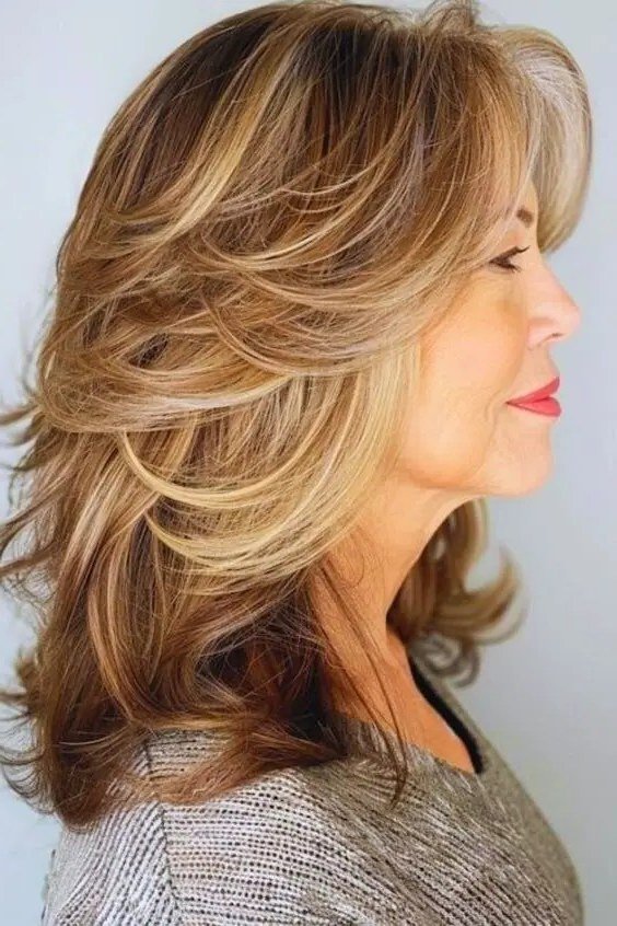 Blonde Feathered Layered Cut with Curtain Bangs for Women Over 40