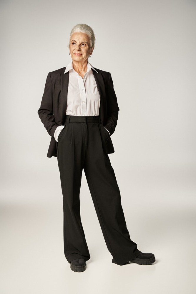 Black blazer with white blouse and wide black trousers, women over 60