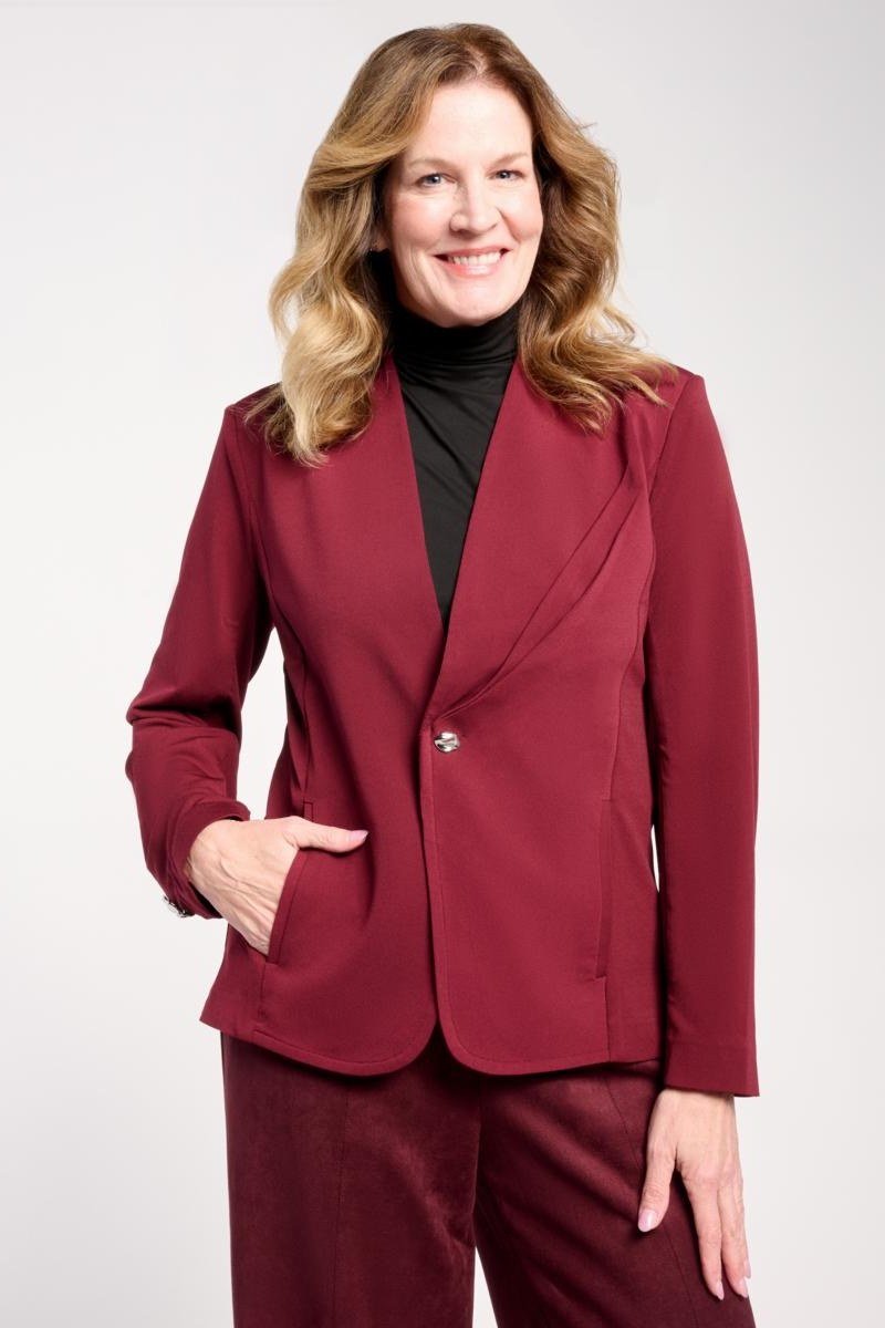 Red blazer with black turtleneck and burgundy trousers