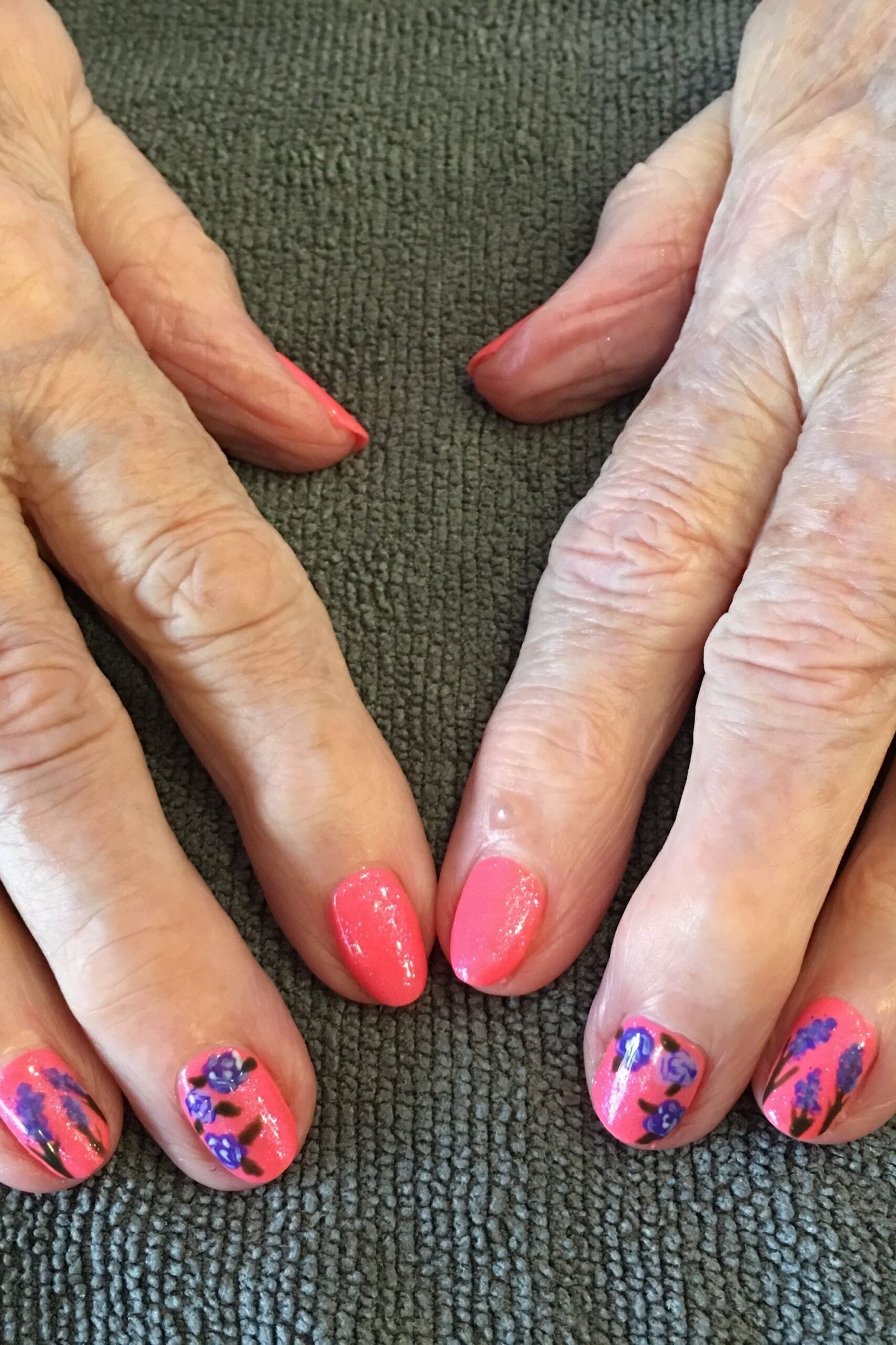 Coral Polish with Blue Floral Accent, best nail colors for 50 year olds