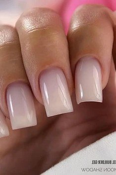 Milky white medium square nails close-up, builder gel manicure for women over 50