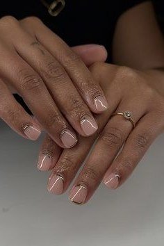 Nude short nails on darker skin hands, crossed, natural builder gel overlay
