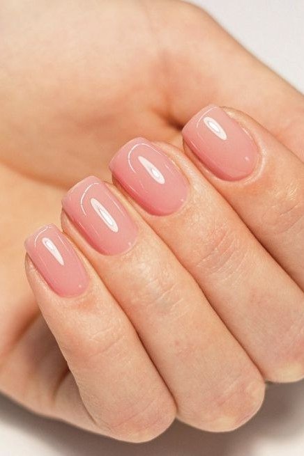 Rosy pink short oval nails with glossy finish, builder gel over 50