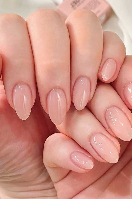 Pink-nude almond nails, two hands together, builder gel manicure