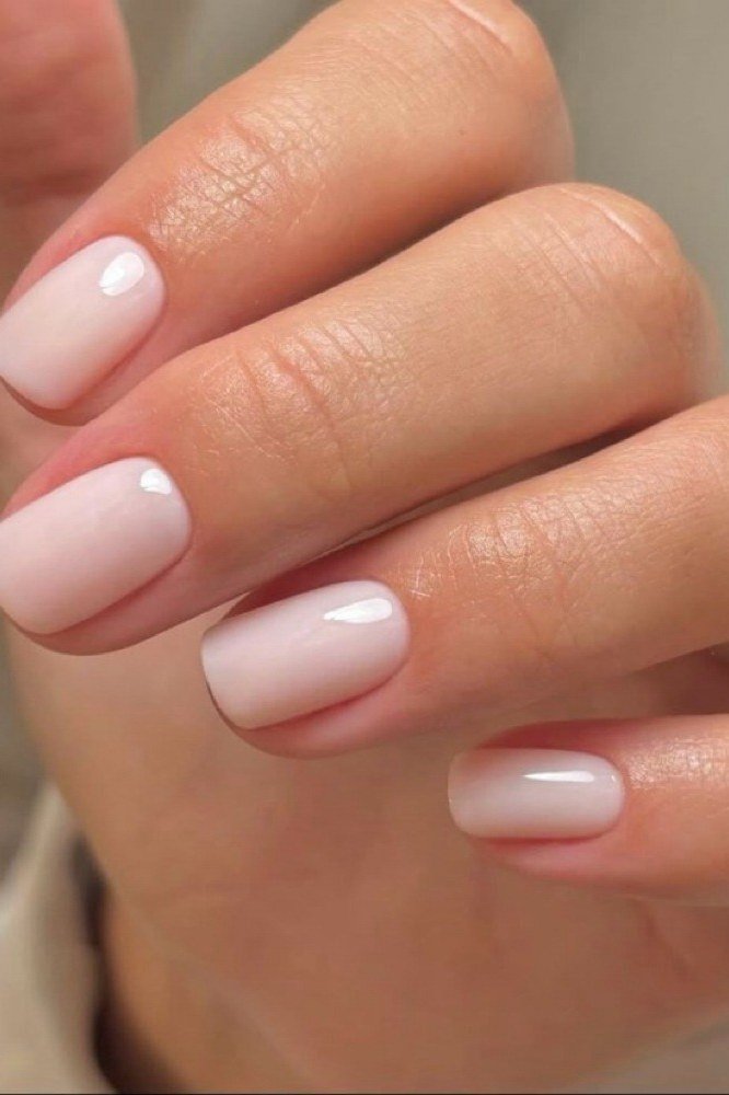 Nude short square nails close-up, natural builder gel overlay