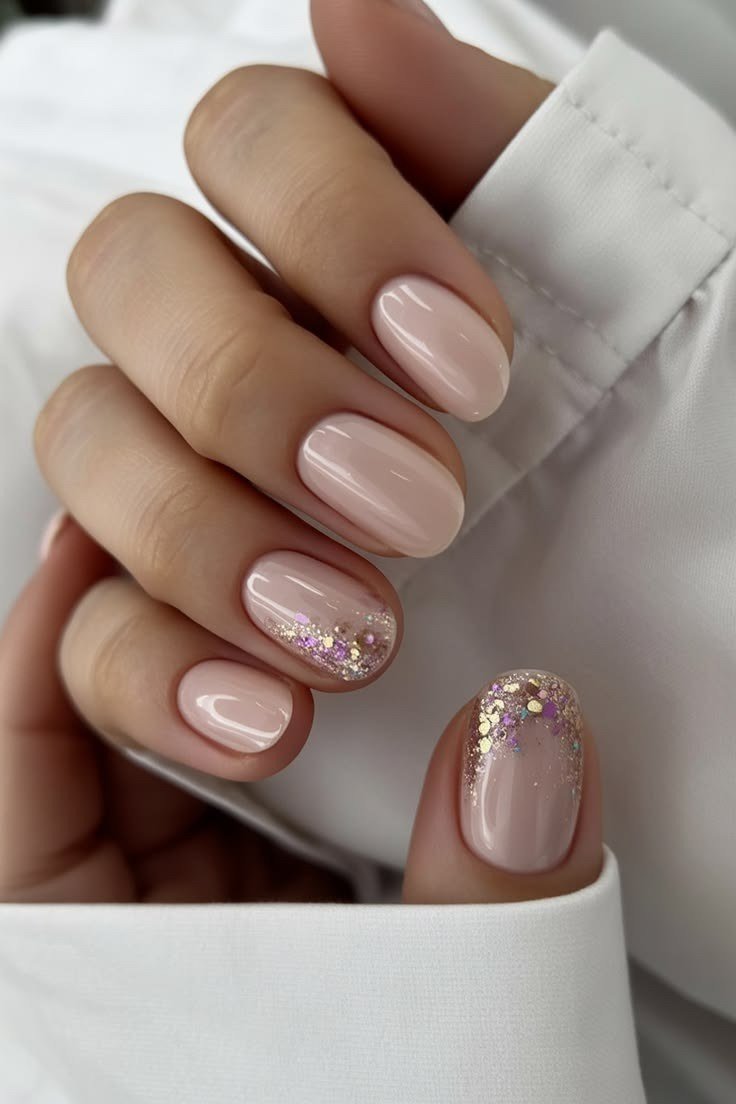 Nude nails with one glitter accent nail, white shirt, builder gel over 50