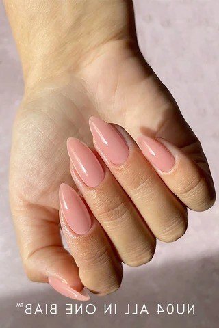Pink-nude almond nails with BIAB product text at bottom, builder gel