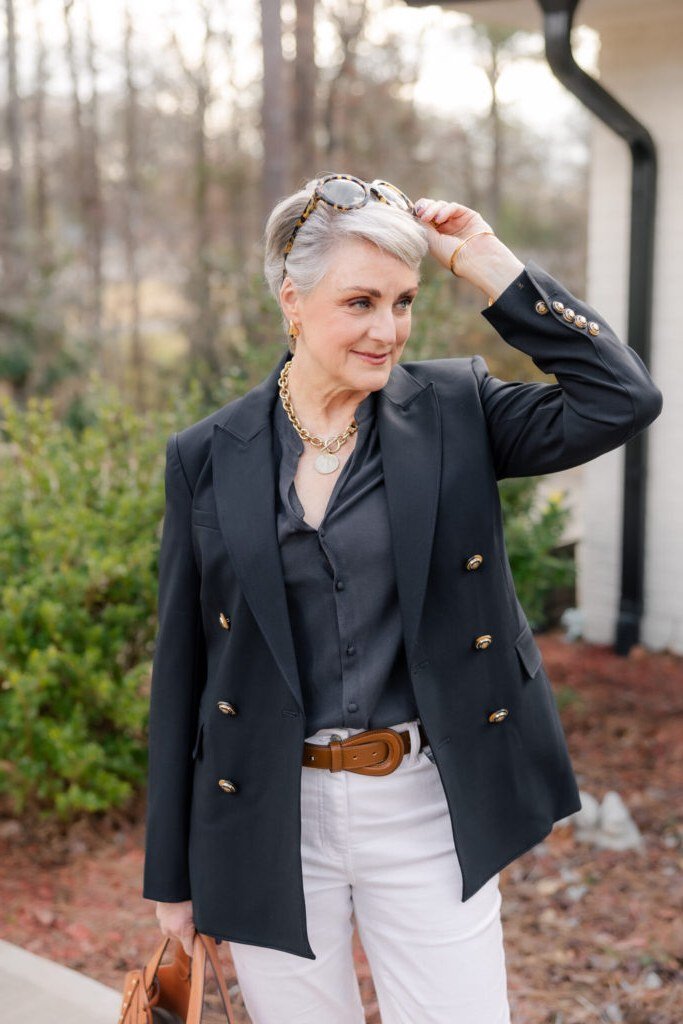 navy double-breasted blazer outfit for women over 50 with white jeans