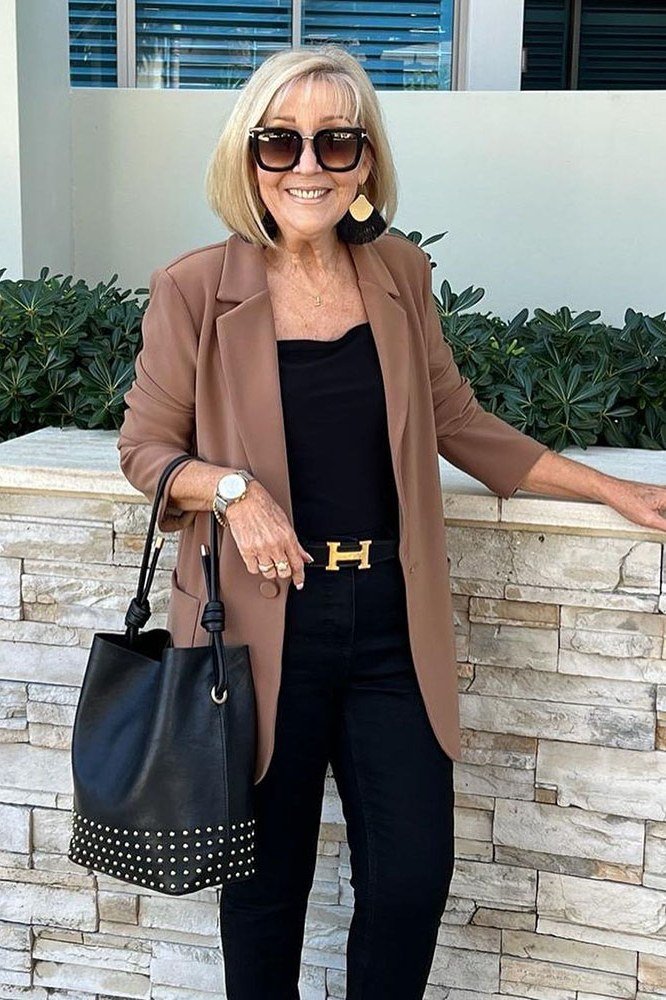 camel blazer with black top and gold belt outfit for women over 50