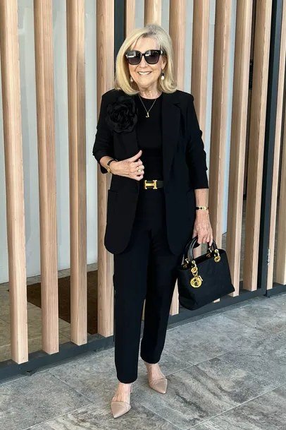black blazer with gold belt and black trousers evening outfit for women over 50
