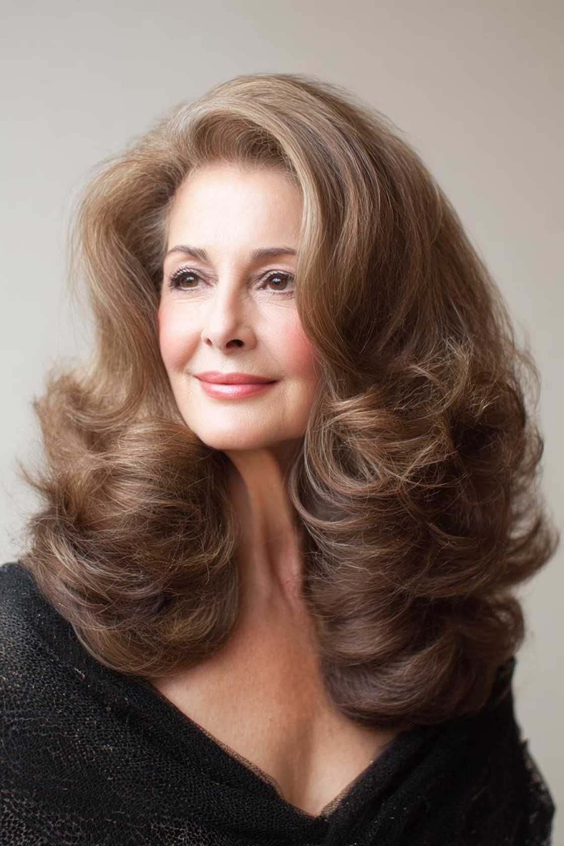 Brunette Bouncy Blowout - shoulder-length blowout hairstyle for women over 60