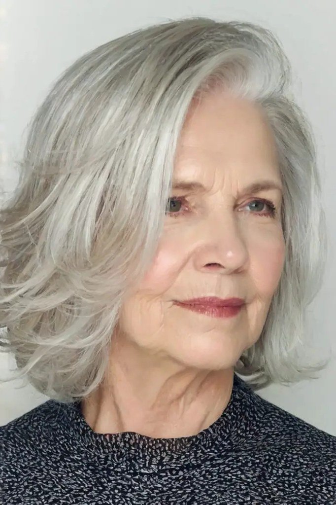 Silver-Grey Blowout Lob - shoulder-length blowout hairstyle for women over 60