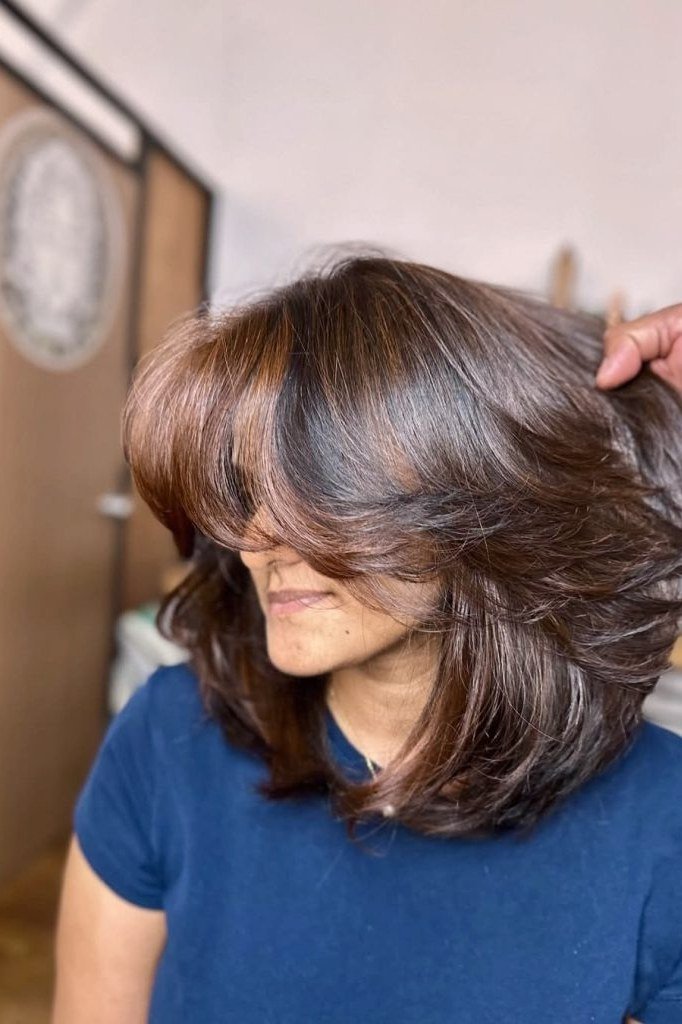 Brunette Smooth Blowout with Crown Lift - shoulder-length blowout hairstyle for women over 60