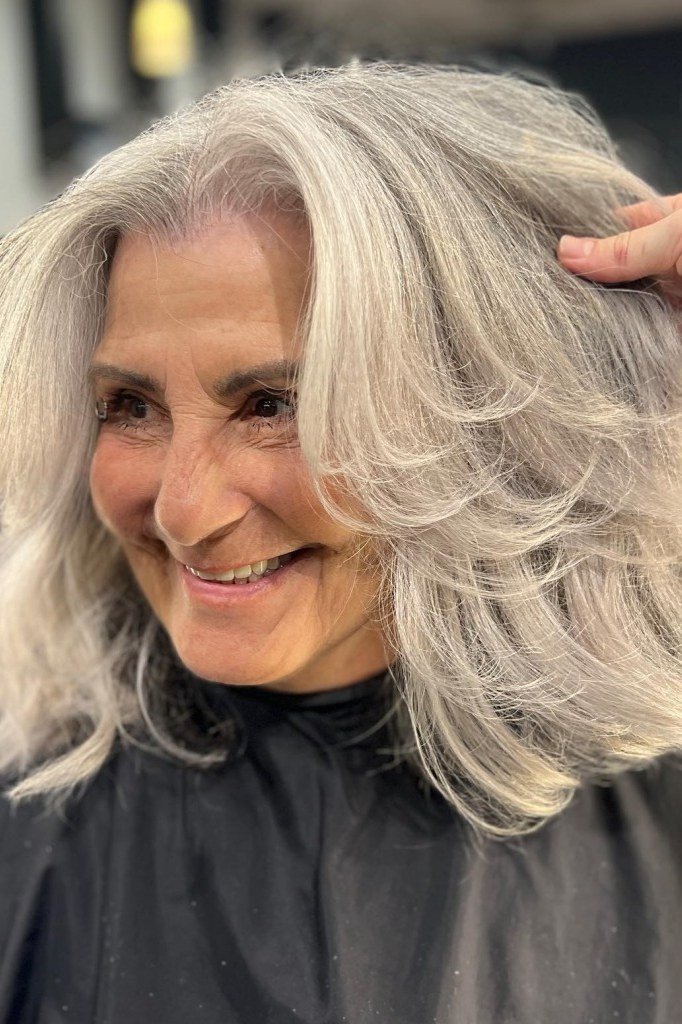 Silver Feathered Blowout - shoulder-length blowout hairstyle for women over 60