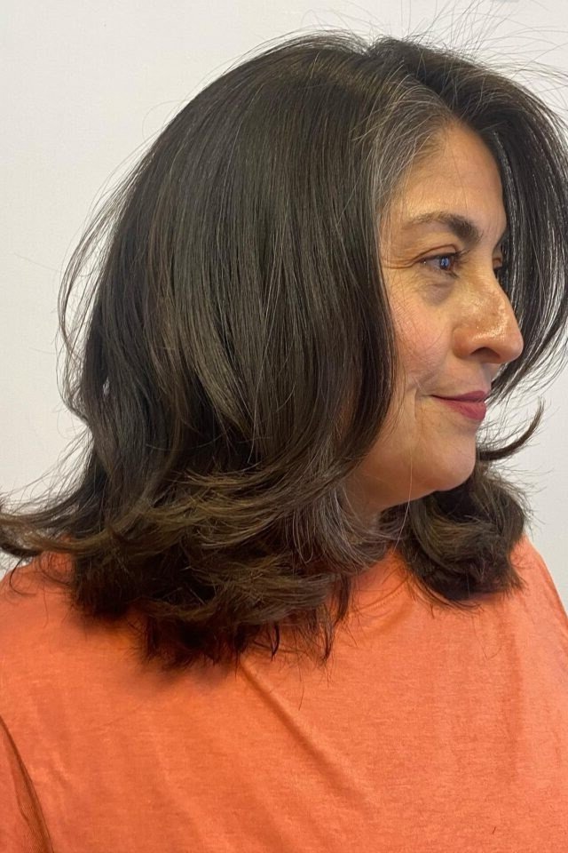 Brunette Shoulder Blowout - shoulder-length blowout hairstyle for women over 60