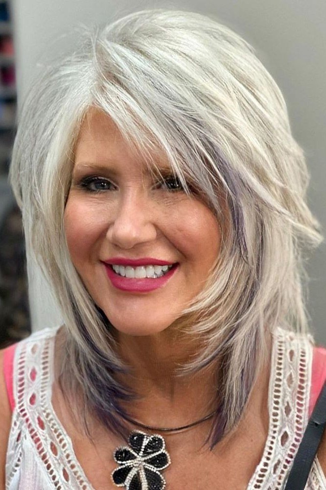 Silver Layered Blowout - shoulder-length blowout hairstyle for women over 60