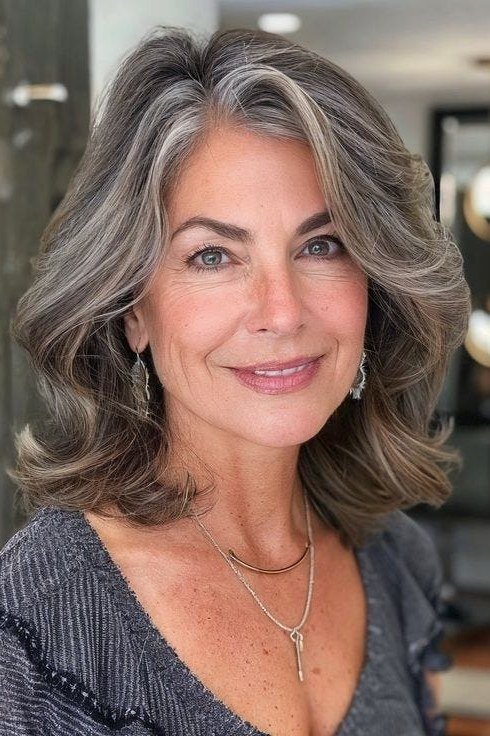 Grey-Brown Blend Blowout - shoulder-length blowout hairstyle for women over 60
