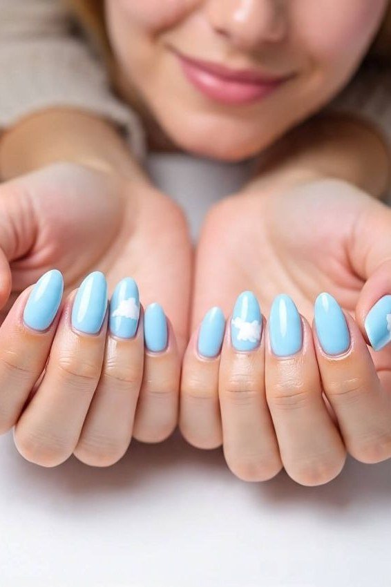 Light blue short oval nails on both hands for women over 50