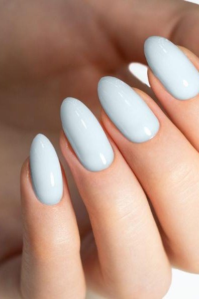 Pale blue oval nails close-up for women over 50