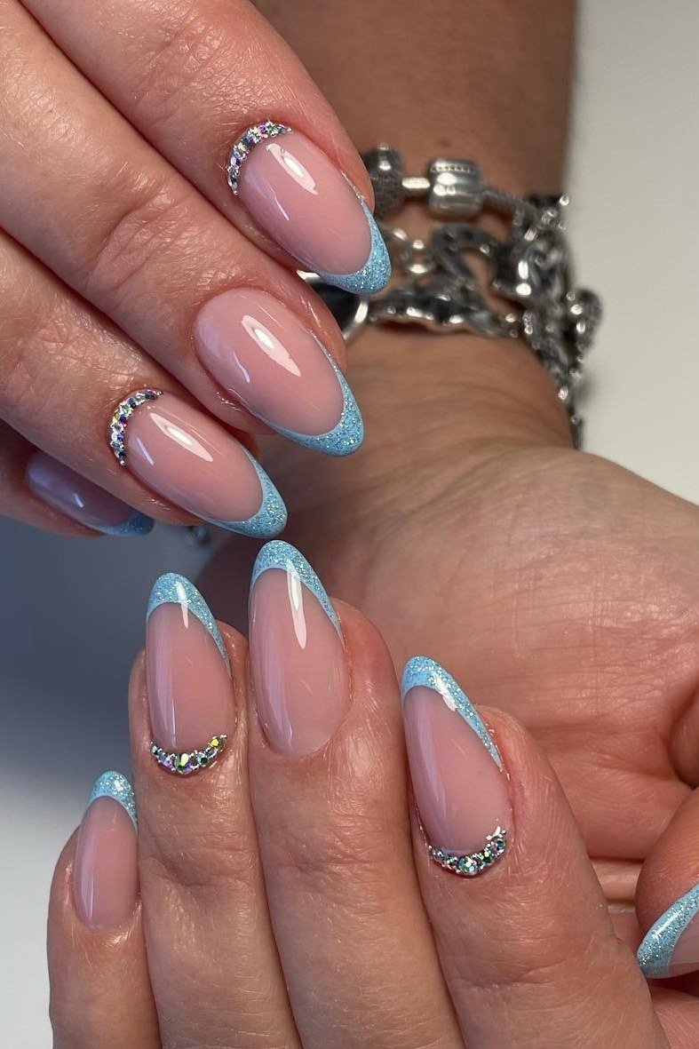 Nude nails with light blue crystal french outline for women over 50