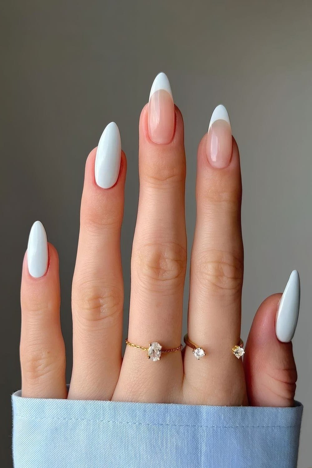 Light blue and nude french almond nails for women over 50