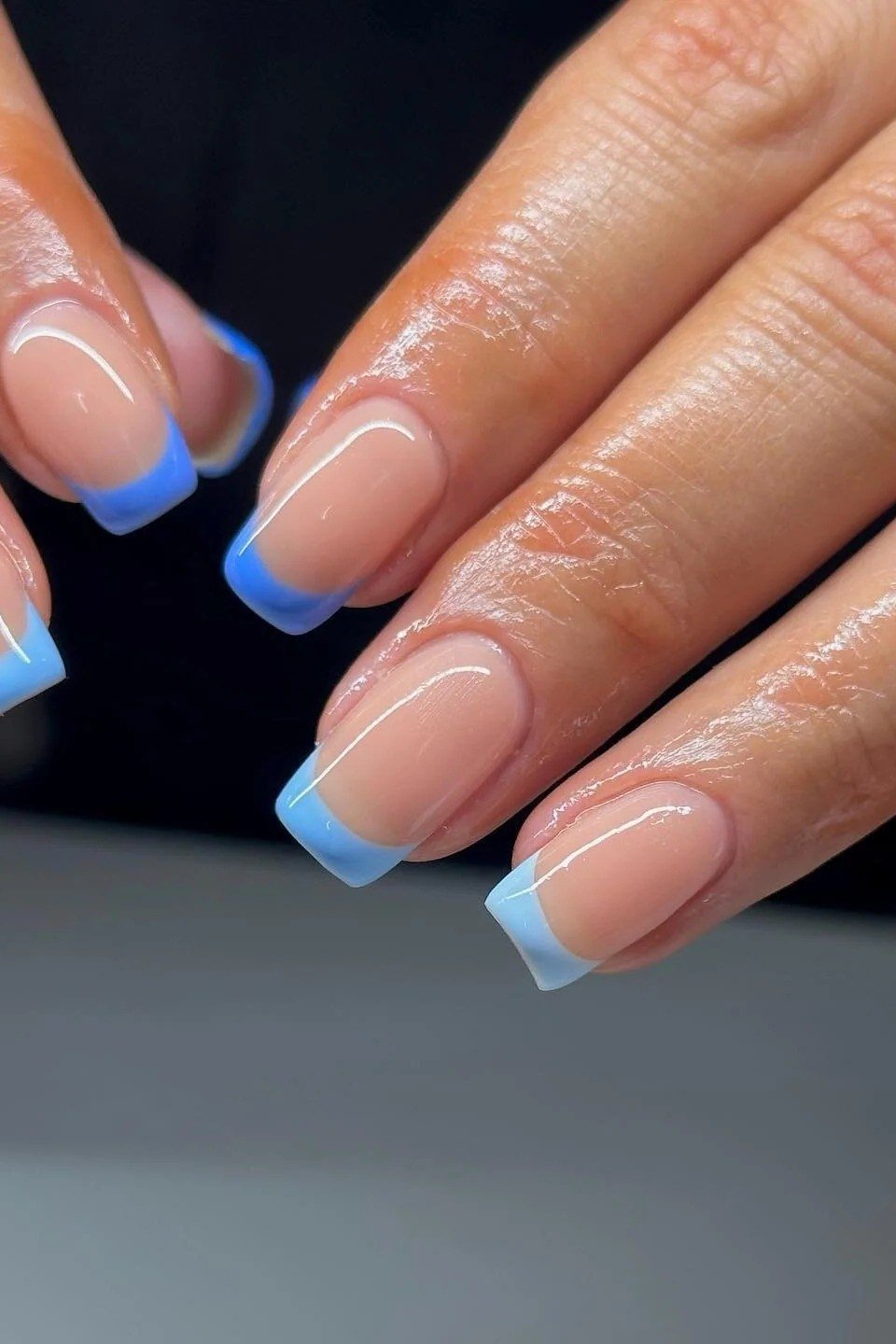 Nude square nails with light blue french tips for women over 50