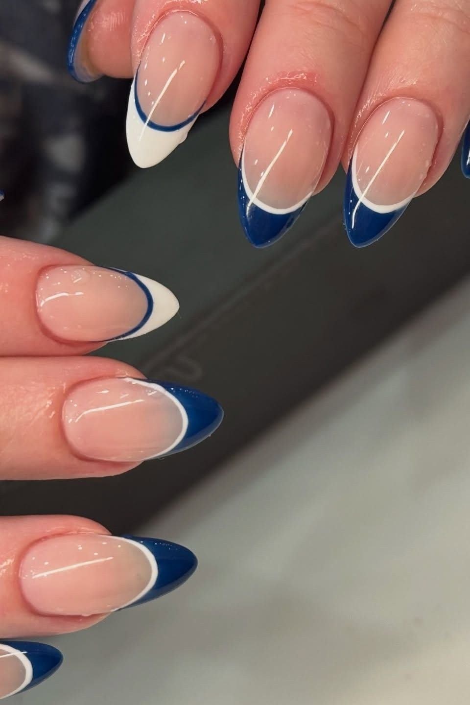 Nude almond nails with blue and white double french tips for women over 50
