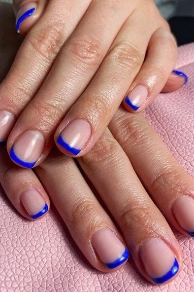 Nude short nails with royal blue french tips for women over 50